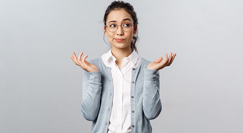 A womne shrugging her shoulders questioning if her association can go viral