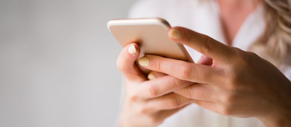 A woman using her mobile device.